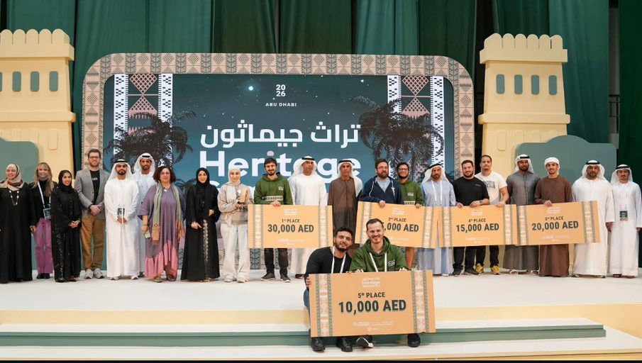 All the winning teams lined up on stage holding their prize cheques.